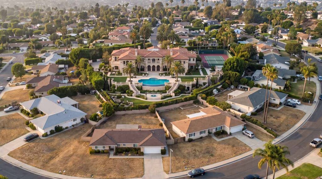 A breathtaking, custom luxury pool and outdoor living space in an Orange County estate, demonstrating how premium backyard remodels significantly increase property value and real estate ROI.